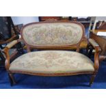 EARLY 20TH CENTURY WALNUT PARLOUR SETTEE WITH CARVED DECORATION ON TURNED SUPPORTS,