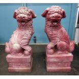 PAIR OF GARDEN ORIENTAL STYLE DOGS ON PLINTHS