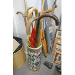 PORCELAIN STICK STAND WITH SELECTION OF WALKING STICKS WOODEN RULERS ETC