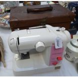 SINGER SEWING MACHINE IN BROWN CASE