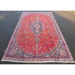 RICH RED GROUND PERSIAN KASHAN CARPET WITH FLORAL MEDALLION DESIGN,