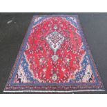 RICH RED GROUND PERSIAN SUROK CARPET WITH MEDALLION DESIGN,