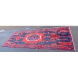 RED AND BLUE GROUND PERSIAN NAHVAN VILLAGE RUG,