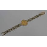 1913 SOVEREIGN SET IN A 9CT GOLD MESHLINK BRACELET - 18.5 CM LONG, 30.