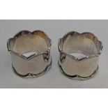 PAIR OF SILVER NAPKIN RINGS WITH SHAPED RIM,