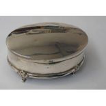 OVAL SILVER JEWELLERY BOX ON 4 SHAPED SUPPORTS,