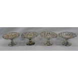 SET OF 4 SILVER PEDESTAL PIN DISHES WITH PIERCED & FOLIATE SCROLL DECORATION,