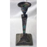 SILVER SQUARE TAPERING CANDLESTICK WITH FLORAL SWAG DECORATION ON A SQUARE BASE,