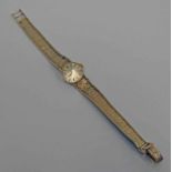 9CT GOLD OMEGA LADIES WRISTWATCH ON A 9CT GOLD BRACELET - 21.