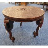 CIRCULAR TOPPED EASTERN TABLE WITH 3 ELEPHANT SHAPED SUPPORTS,