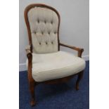 20TH CENTURY BUTTON BACK ARMCHAIR ON SUPPORTS SHAPED