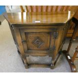 OAK HALL TABLE WITH CARVED PANEL DOOR ON TURNED SUPPORTS Condition Report: The item