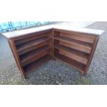 19TH CENTURY OAK CORNER BOOKCASE WITH OPEN SHELVES ON SQUARE SUPPORTS.