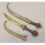 2 NORTH AFRICAN JAMBIYAS WITH WHITE METAL MOUNTS & SCABBARDS