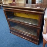 EARLY 20TH CENTURY MAHOGANY SECTIONAL BOOKCASE WITH GLASS PANEL DOORS OVER DRAWER,