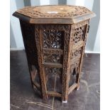 EASTERN HARDWOOD OCTAGONAL TABLE WITH DECORATIVE ORIENTAL CARVING,