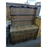 CARVED OAK DRESSER WITH SHELF BACK OVER 2 DRAWERS & 2 PANEL DOORS,