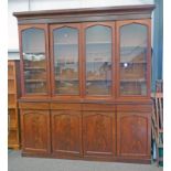 19TH CENTURY MAHOGANY BREAKFRONT BOOKCASE WITH 4 GLASS PANEL DOORS OVER BASE OF 4 DRAWERS OVER 4