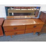 TEAK DRESSING CHEST WITH MIRROR OVER 4 DRAWERS ON TAPERED SUPPORTS.