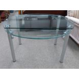 GLASS TOPPED TABLE WITH 2 LEAVES ON METAL SUPPORTS,