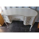 WHITE & GILT KIDNEY TOPPED DRESSING TABLE OF 5 DRAWERS ON QUEEN ANNE SUPPORTS,