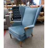 WINGBACK ARMCHAIR ON TURNED SUPPORTS Condition Report: The item has some wear to the