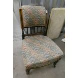BLACK & GILT NURSING CHAIR WITH BURR INLAY ON REEDED SUPPORTS