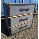 FABRIC CHEST OF 3 DRAWERS WITH BRASS & LEATHER FIXTURES,