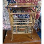 BAMBOO MAGAZINE RACK WITH PAINTED ORIENTAL SCENE IN TOP