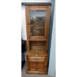 ERCOL ELM CABINET WITH GLASS PANEL DOOR OVER BASE OF DRAWER OVER PANEL DOOR,