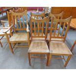 SET OF 5 OAK KITCHEN CHAIRS WITH ROPEWORK SEATS ON SQUARE SUPPORTS INCLUDING 1 ARMCHAIR