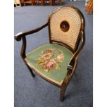 EBONISED ARMCHAIR WITH BERGERE BACK,