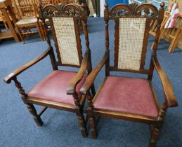PAIR OF LATE 19TH CENTURY OAK FRAMED OPEN ARMCHAIRS WITH DECORATIVE CARVING & BERGERE BACKS ON
