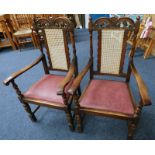 PAIR OF LATE 19TH CENTURY OAK FRAMED OPEN ARMCHAIRS WITH DECORATIVE CARVING & BERGERE BACKS ON