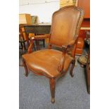 MAHOGANY FRAMED FRENCH OPEN ARMCHAIR WITH LEATHER BACK & SERPENTINE SEAT ON CABRIOLE SUPPORTS