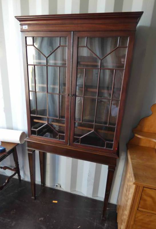 19TH CENTURY MAHOGANY BOOKCASE WITH SHELVED INTERIOR AND 2 ASTRAGAL GLASS DOORS OVER BASE OF 4