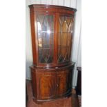 20TH CENTURY MAHOGANY CORNER CABINET WITH 2 ASTRAGAL GLASS PANEL DOORS OVER 2 PANEL DOORS ON