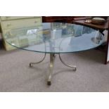 LARGE GLASS TOPPED CIRCULAR TABLE ON METAL PEDESTAL WITH 4 SPREADING SUPPORTS.