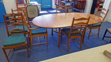 ERCOL WALNUT EXTENDING DINING TABLE WITH FOLD OUT LEAF AND SET OF 6 ERCOL LADDER BACK CHAIRS