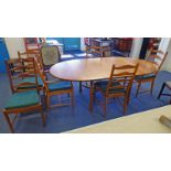 ERCOL WALNUT EXTENDING DINING TABLE WITH FOLD OUT LEAF AND SET OF 6 ERCOL LADDER BACK CHAIRS