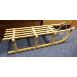 CHILD'S WOODEN SLEDGE Condition Report: The item has rust to the metal mounts