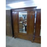 19TH CENTURY MIRROR DOOR WARDROBE OVER BASE OF SINGLE DRAWERS WITH CARVED DECORATION.