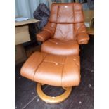 TAN LEATHER SWIVEL RECLINING ARMCHAIR & MATCHING STOOL. MARKED STRESSLESS.