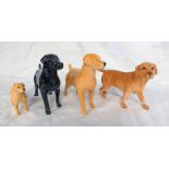 FOUR PORCELAIN LABRADORS FROM BESWICK & ROYAL DOULTON.
