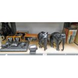 PAIR OF EBONY ELEPHANTS AND DESK SET AND OTHERS OVER ONE SHELF