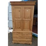 PINE TALL BOY WITH 2 PANEL DOORS OVER BASE OF 2 SHORT OVER 2 LONG DRAWERS.