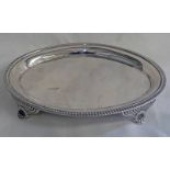 GEORGE III SILVER OVAL TEAPOT STAND WITH 4 SCROLL SUPPORTS, LONDON 1809 - 21.