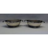 PAIR OF GEORGE III SILVER OVAL SALTS WITH TWIN SCROLL HANDLES,