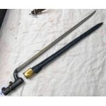 1876 PATTERN SOCKET BAYONET WITH 44CM LONG TRIANGULAR BLADE WITH ITS BRASS MOUNTED LEATHER SCABBARD