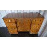 LATE 19TH/EARLY 20TH CENTURY PINE DESK WITH CENTRAL PANEL DOOR FLANKED EACH SIDE BY 4 DRAWERS,